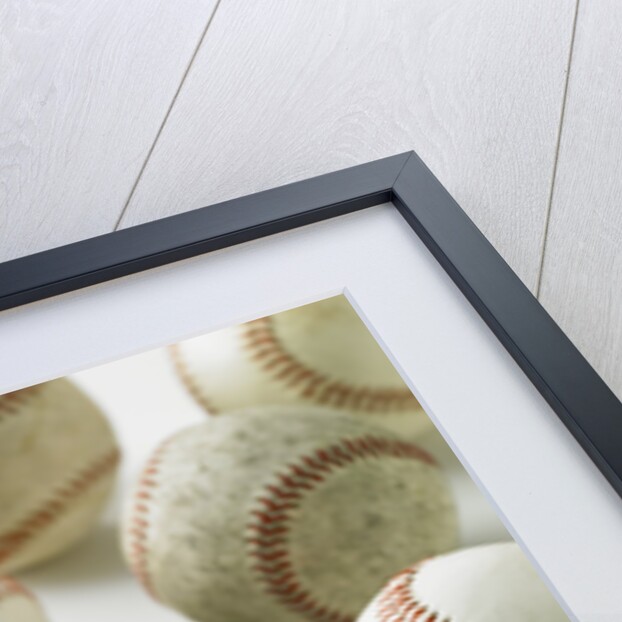 Old and new baseballs gathered together by Anonymous