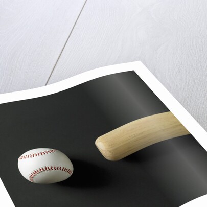 Directly-above view of a bat and a ball in a row by Anonymous