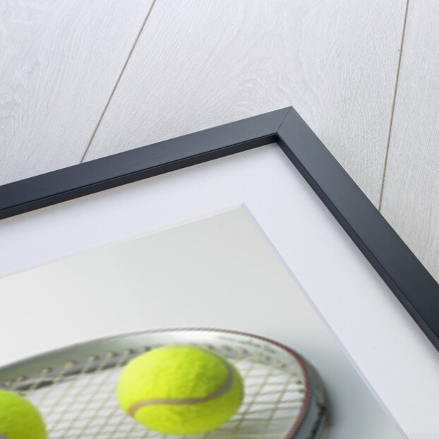 A tennis racket and balls by Anonymous