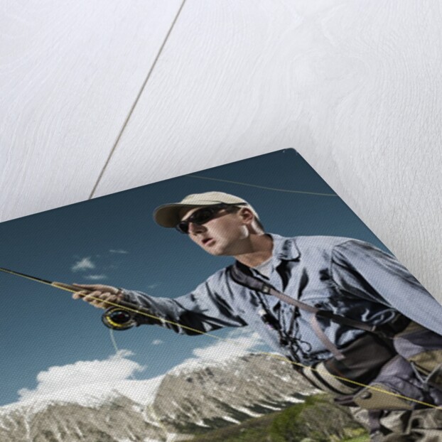 Man fly fishing with dog by Anonymous