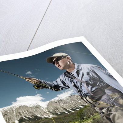 Man fly fishing with dog by Anonymous