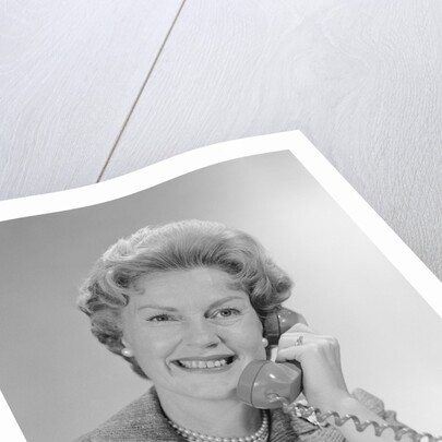 Portrait smiling mature woman talking on telephone by Anonymous