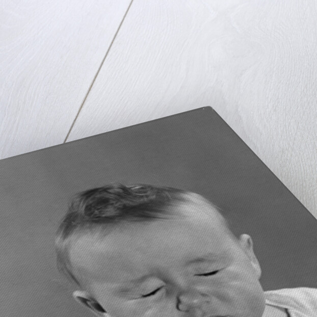 Portrait baby with eyes tightly closed by Anonymous