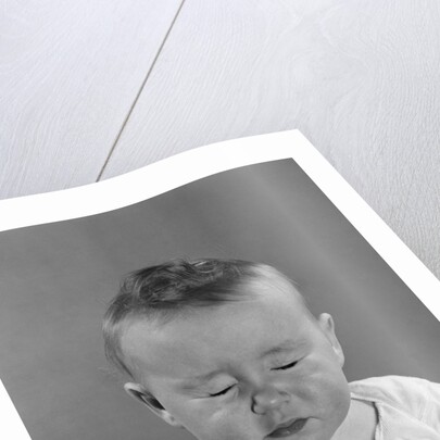 Portrait baby with eyes tightly closed by Anonymous