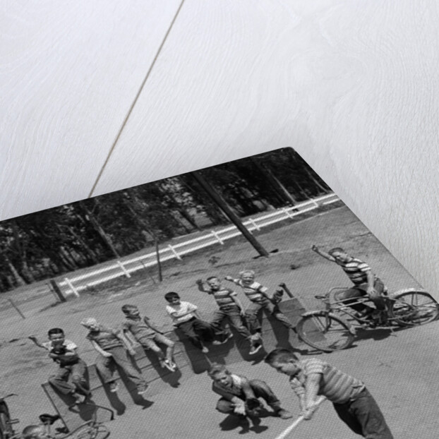 10 neighborhood boys playing sand lot baseball most wear blue jeans tee shirts by Anonymous