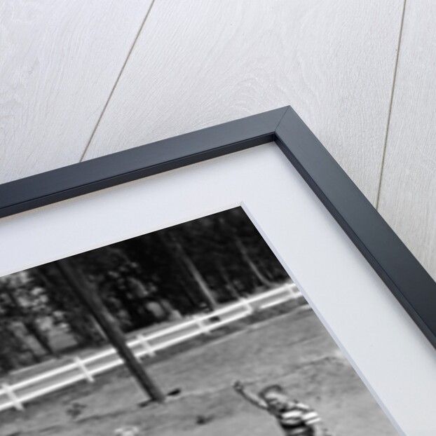 10 neighborhood boys playing sand lot baseball most wear blue jeans tee shirts by Anonymous