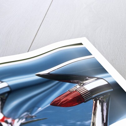 Detail fins rear tail lights blue cadillac auomobile by Anonymous