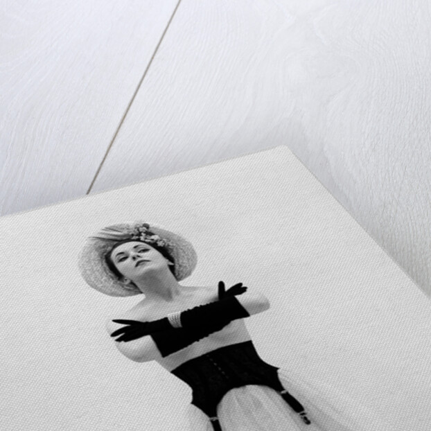 Woman topless wearing straw hat long gloves black garter belt arms folded in front by Anonymous