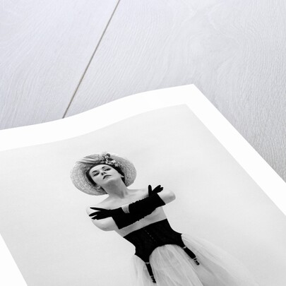 Woman topless wearing straw hat long gloves black garter belt arms folded in front by Anonymous