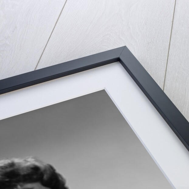 Brunette woman knit dress offhand gesture serious expression by Anonymous