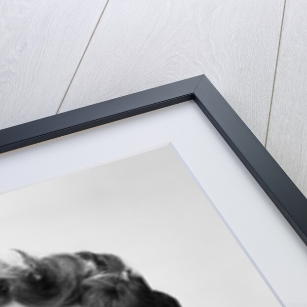 Smiling woman counting on fingers wearing pearls by Anonymous