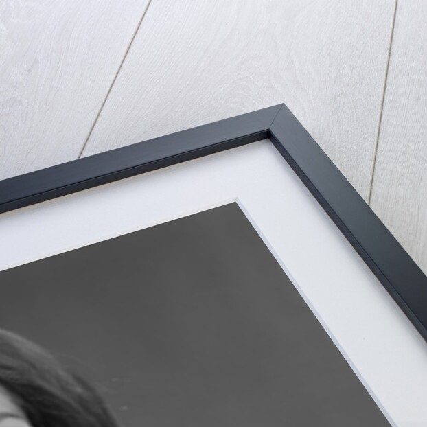 Blond woman magnifying glass held up to and enlarging one eye by Anonymous