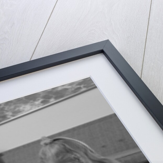 Family mother kids playing board game living room floor father reading newspaper by Anonymous