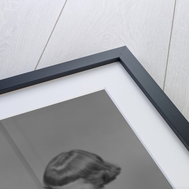 Two twin girls eating making candy apples in kitchen by Anonymous
