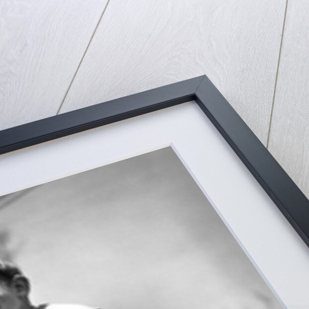 Boy on seesaw smiling by Anonymous