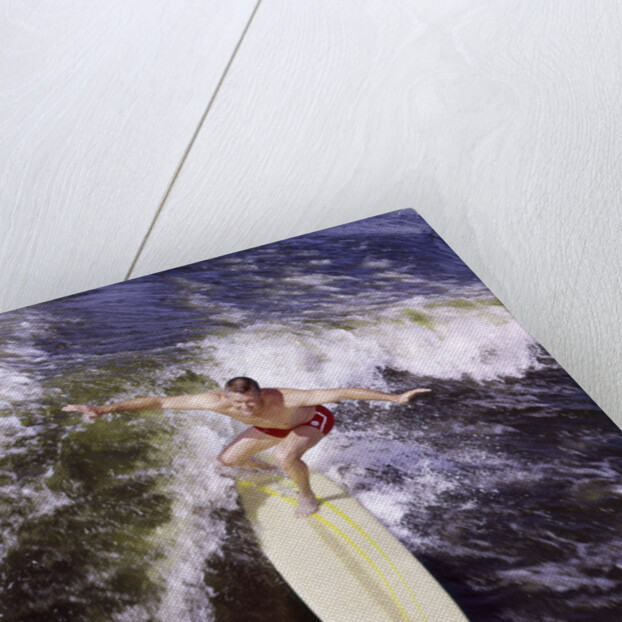 Young man red swim trunks yellow surfboard riding a wave surfing by Anonymous