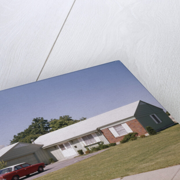 Suburban brick home with car driveway near dayton ohio by Anonymous