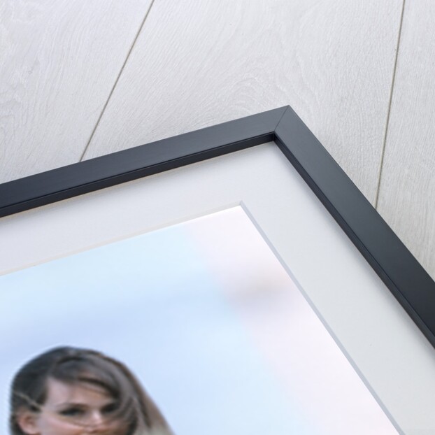 Young woman field of flowers print dress straw hat by Anonymous