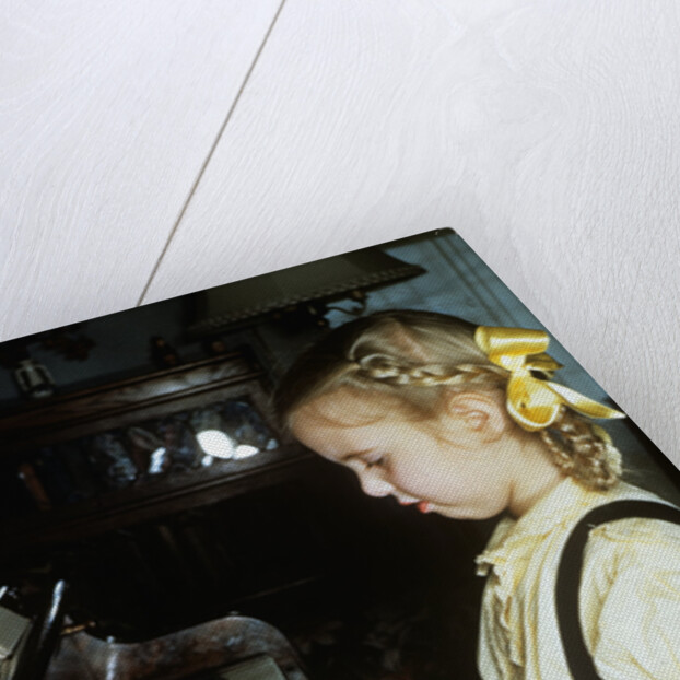 Little blond girl playing practicing the piano by Anonymous