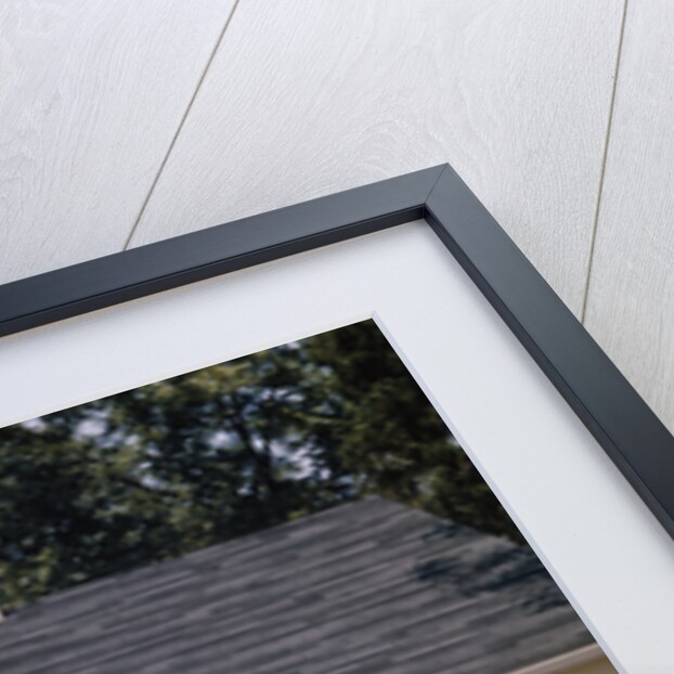 Family father mother 3 sons loading car and trailer for camping vacation by Anonymous