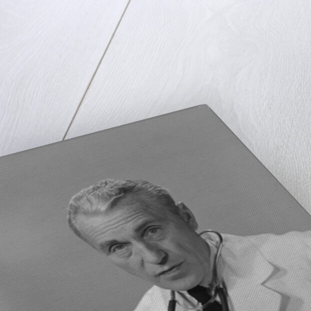 Male doctor holding stethoscope by Anonymous