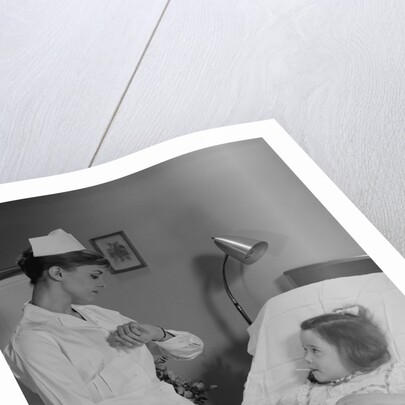 Woman nurse checking pulse taking temperature on little girl patient in hospital bed by Anonymous