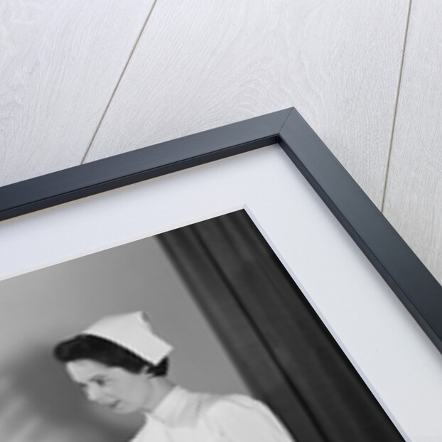 Man doctor woman nurse talking with male patient lying in hospital bed by Anonymous