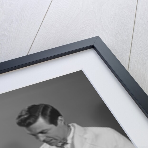 Man doctor woman nurse talking to smiling female patient sitting in hospital wheelchair by Anonymous