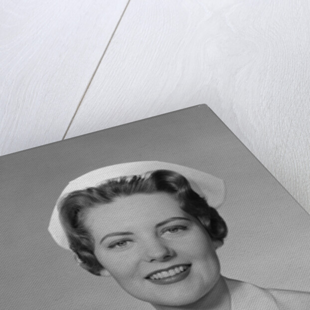 Portrait female nurse smiling by Anonymous