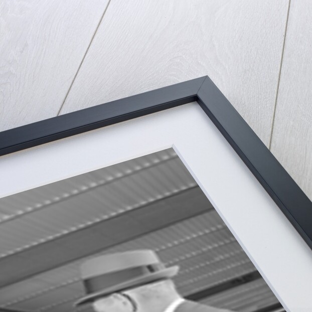 Businessman making a deposit into savings account with bank teller by Anonymous