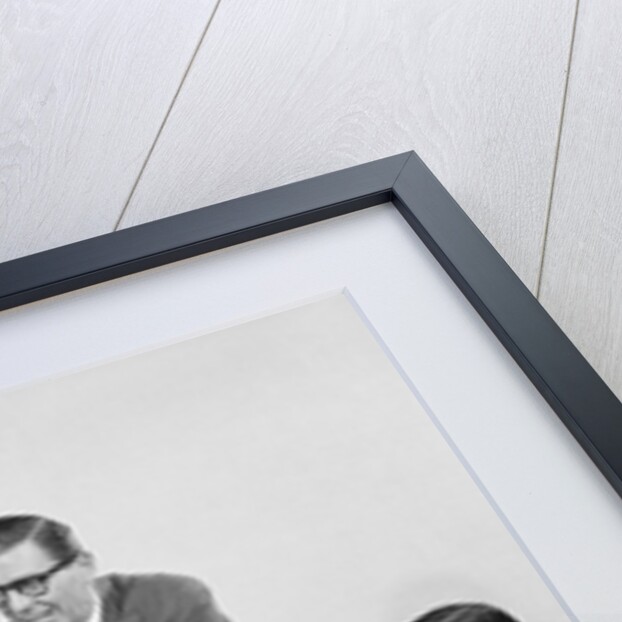 5 executive businessmen meeting at conference table one man standing by Anonymous