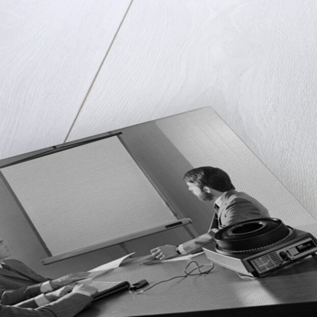 Three executive businessmen conference table audiovisual presentation by Anonymous