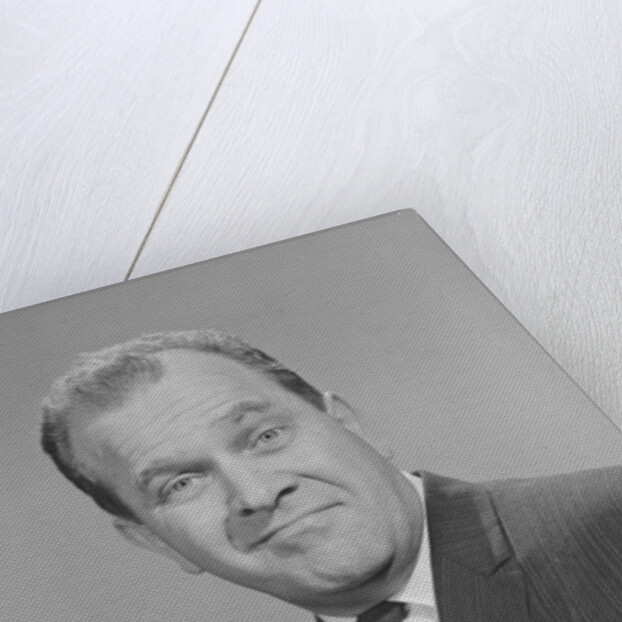 Portrait man pointing wearing suit tie smiling by Anonymous