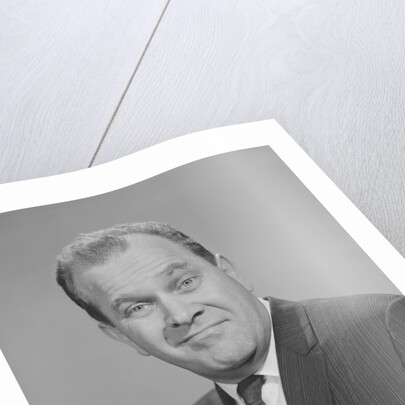 Portrait man pointing wearing suit tie smiling by Anonymous