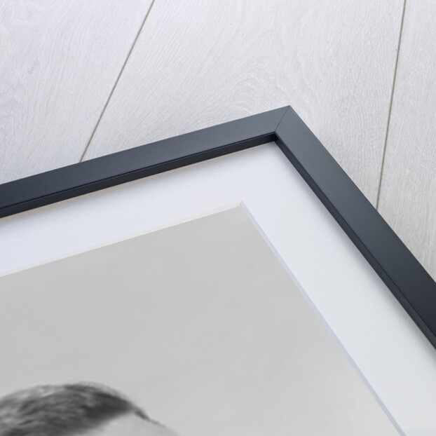 Smiling man holding a fistful of money fake bills by Anonymous