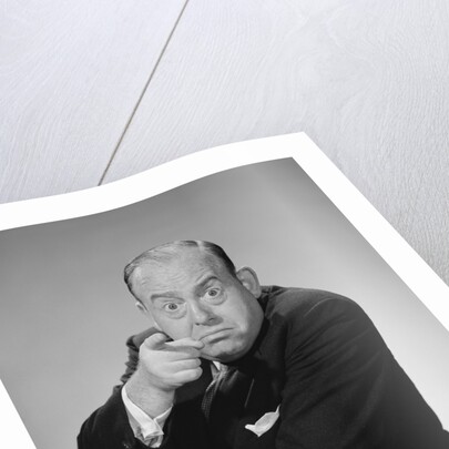 Angry businessman pointing finger bulging staring eyes wide open by Anonymous