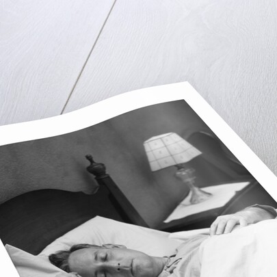 Man sleeping asleep in bedroom by Anonymous