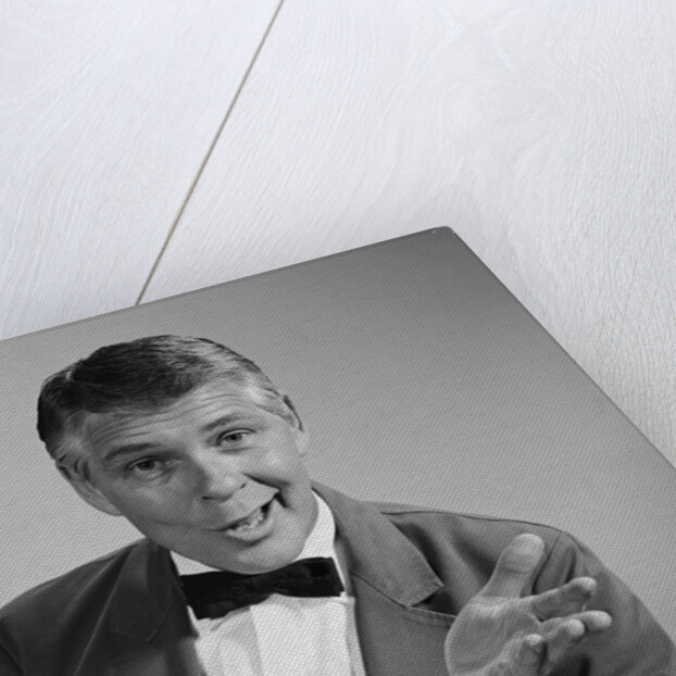 Portrait man wearing bow tie quizzical facial expression & gesture by Anonymous