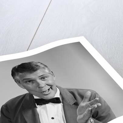 Portrait man wearing bow tie quizzical facial expression & gesture by Anonymous