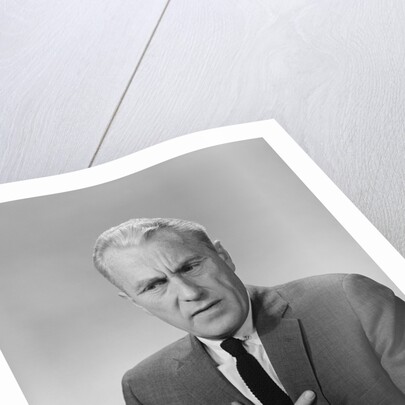 Older man hand to stomach upset nauseous worried facial expression by Anonymous