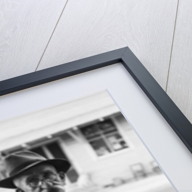 Portrait of old man wearing hat glasses tie & suspenders car in background by Anonymous