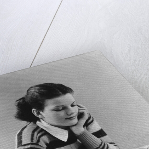 Young brunette woman teen striped sweater reading book studying by Anonymous
