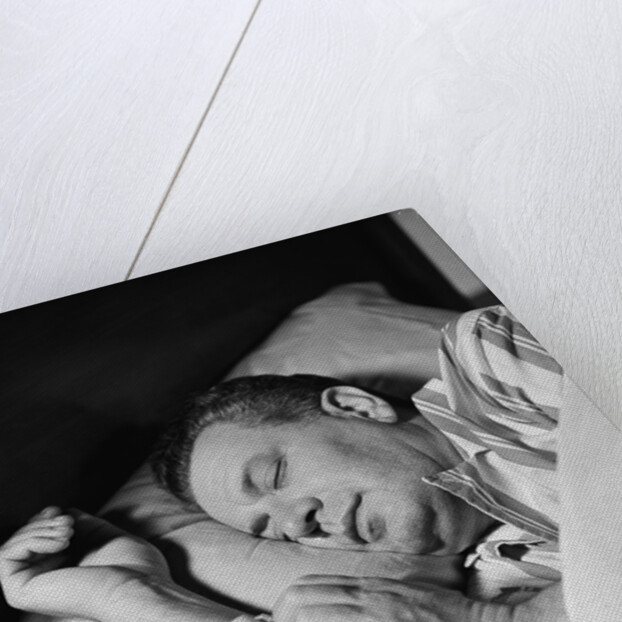 Man asleep sleeping in bed wearing pajamas by Anonymous