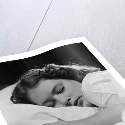 Girl sleeping head on pillow by Anonymous