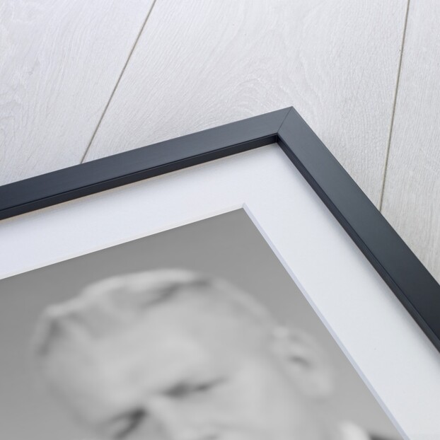 Elderly man soft focus behind hourglass by Anonymous