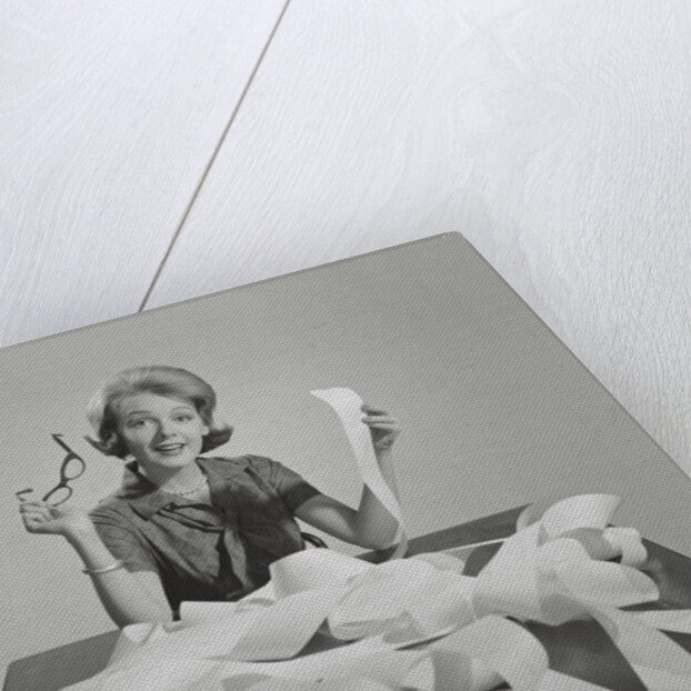 Woman holding eyeglasses and end of extremely long tape from office machine by Anonymous