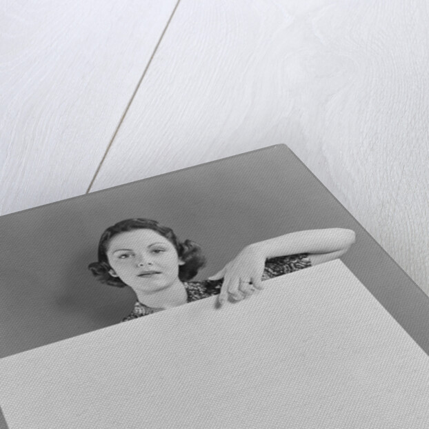Woman holding blank poster sign hand pointing from top by Anonymous