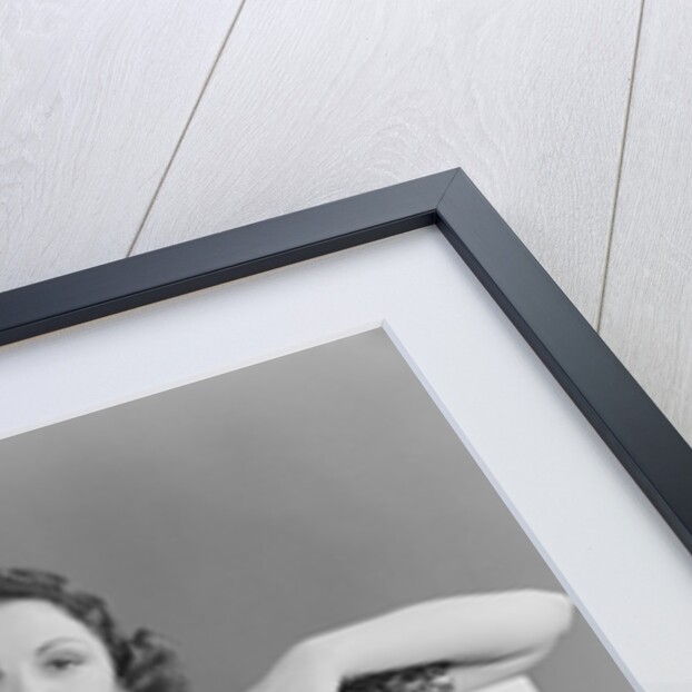 Woman holding blank poster sign hand pointing from top by Anonymous