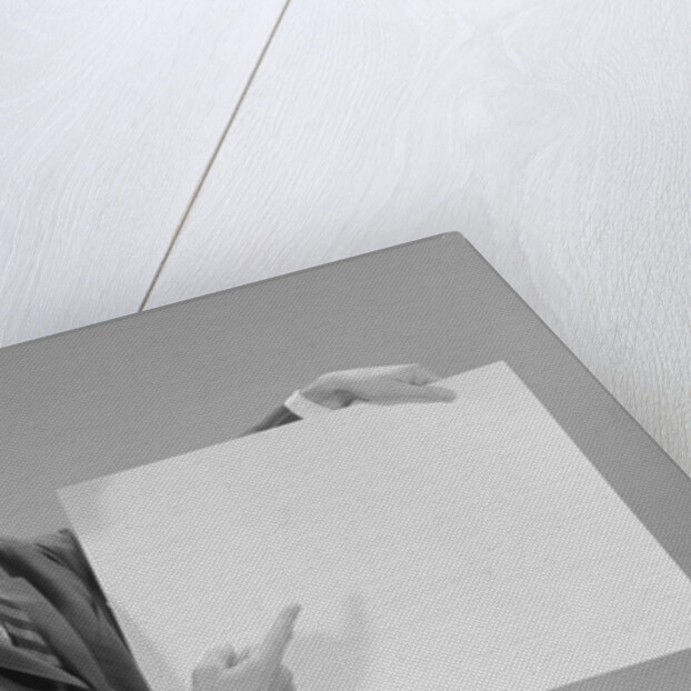 Smiling man pointing to blank poster by Anonymous