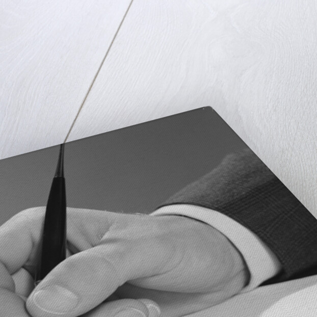 Male hand writing with fountain pen on blank paper by Anonymous